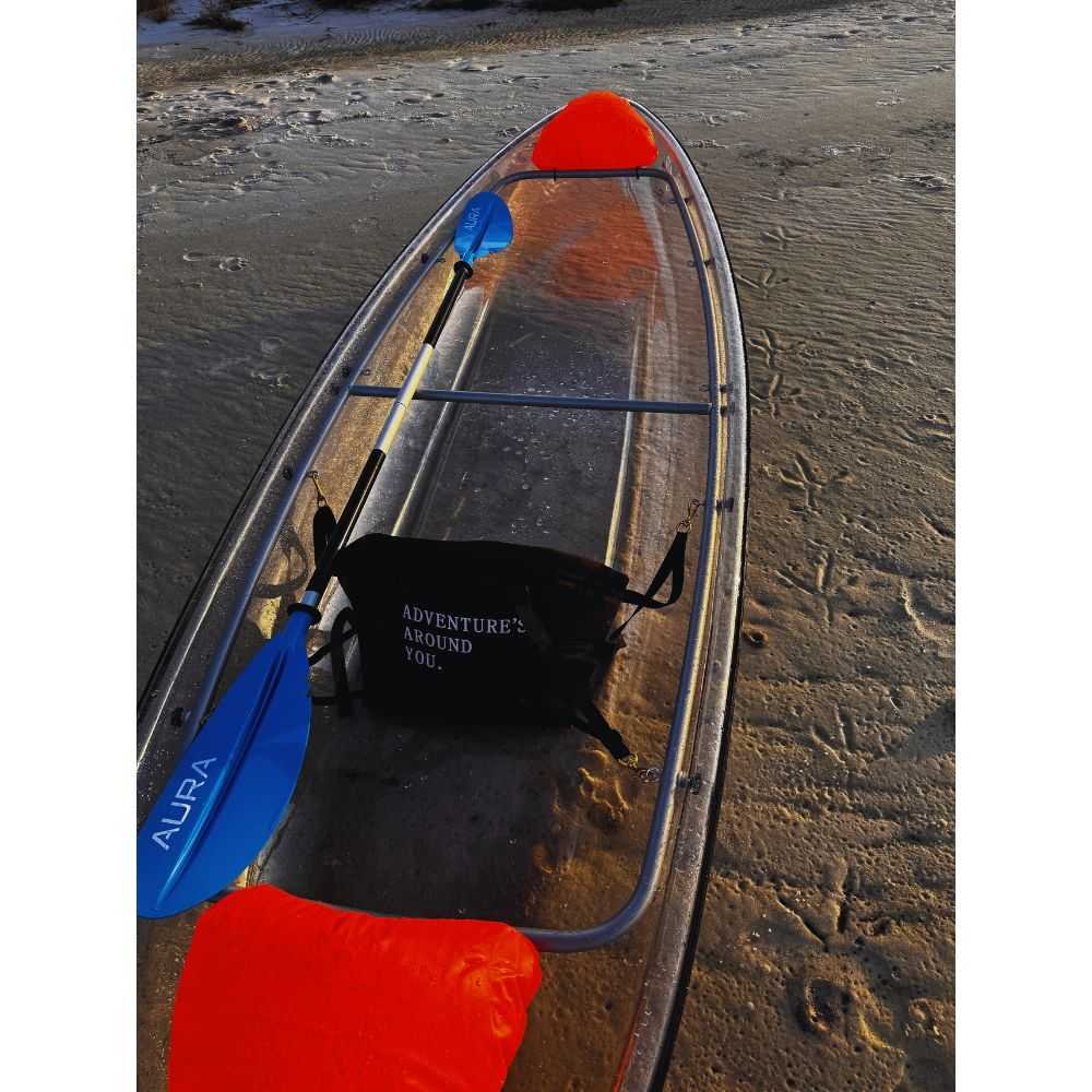 Aura Kayaking Adventurer see through kayak on beach with one seat installed.