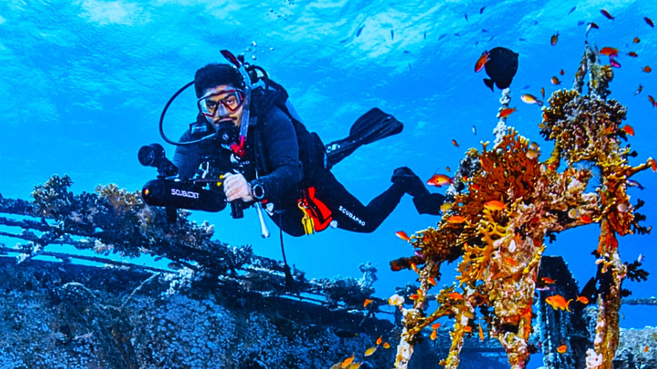 Wreck diver using SCUBAJET PRO Dive Kit underwater scooter.