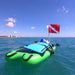 Squatch and Siren Sea Sleigher moray green most useful dive accessory inflatable raft with gear and dive flag on top.