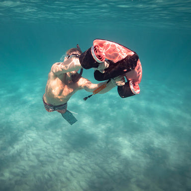 Snorkeler underwater with Sublue Navbow Sea Scooter.