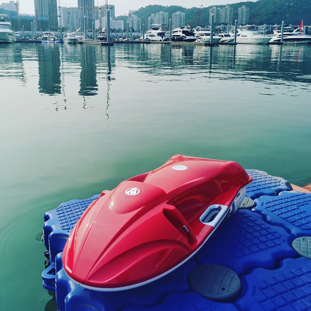 FIRDUO Electric Jet Bodyboard Proton Red at a Marina