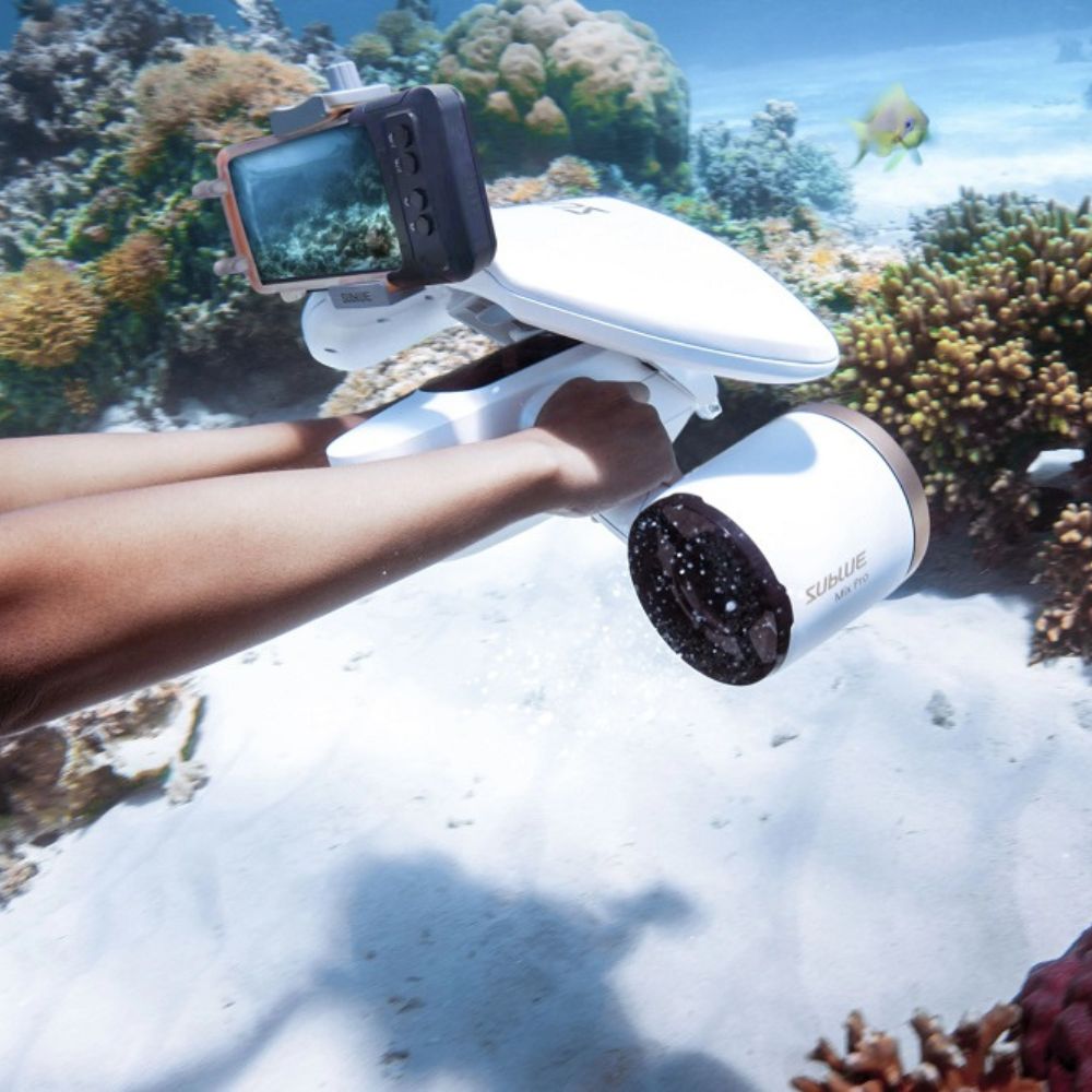 Sublue WhiteShark MixPro underwater scooter in use in the ocean with a H1 waterproof phone case attached.