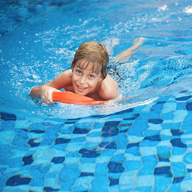 Sublue Swii Electronic Kickboard child in pool.
